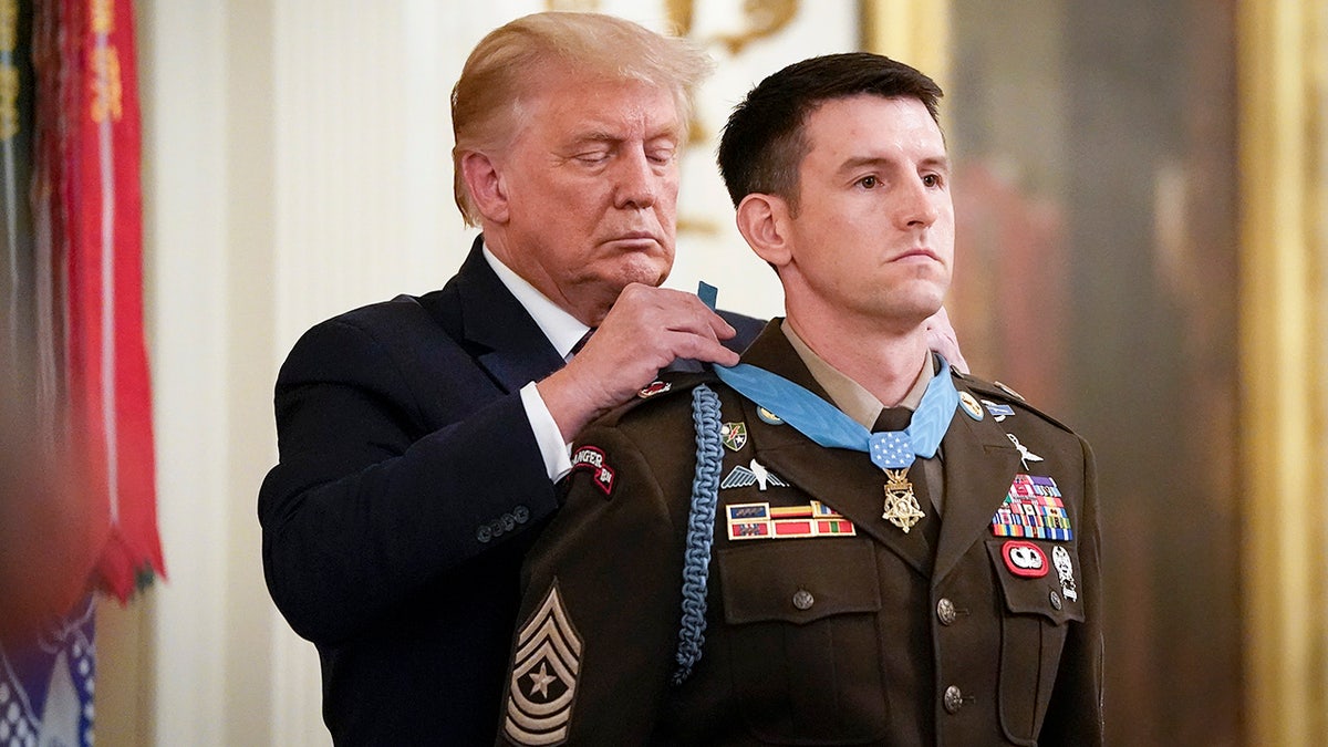 Trump places Medal of Honor around Sgt. Maj. Thomas P. Payne